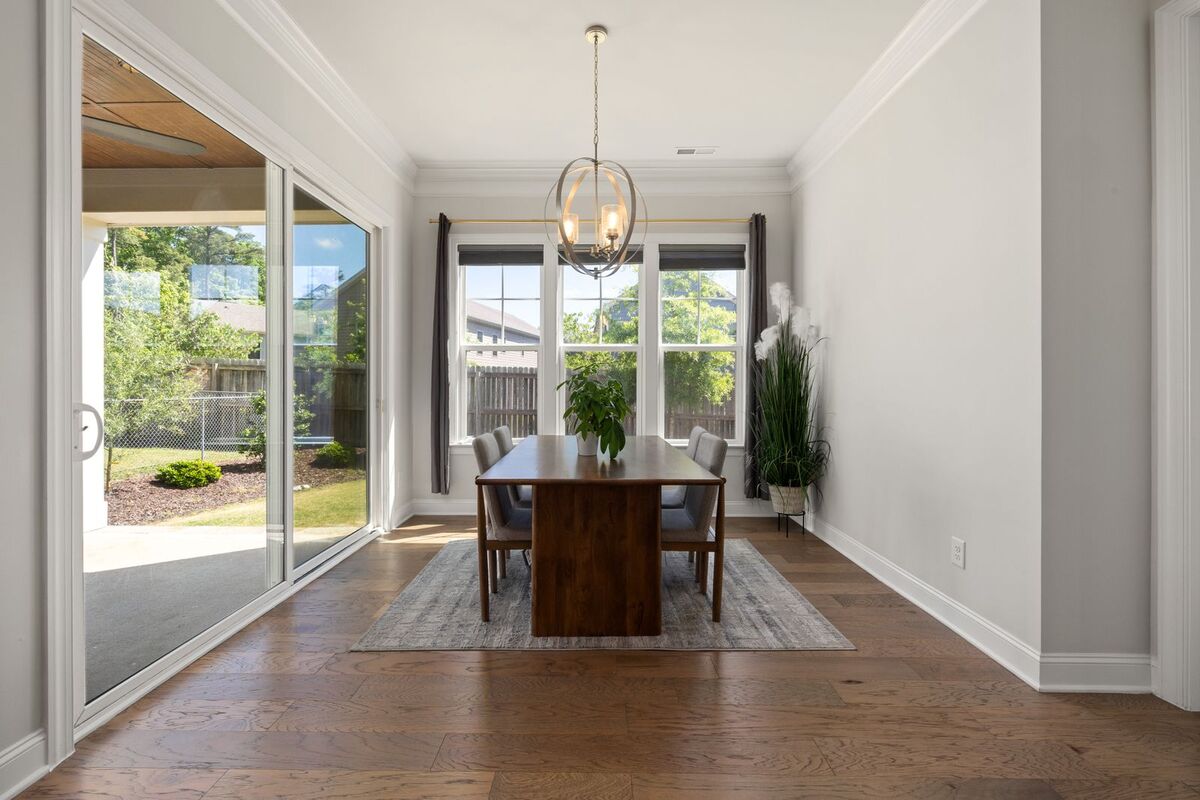 Dining room with a chandelier centred over the table